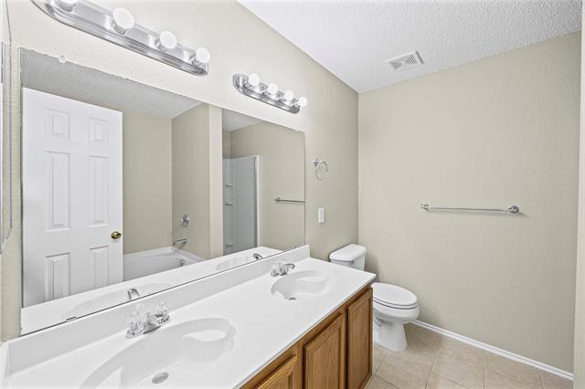 Building Photo - 8409 Redheart St