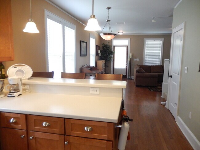 Building Photo - GLAMOROUS 3/2.5 w/ Pond View, Deck, Stainless Appliances, Wood Floors, Fireplace, & More! $2150/m...