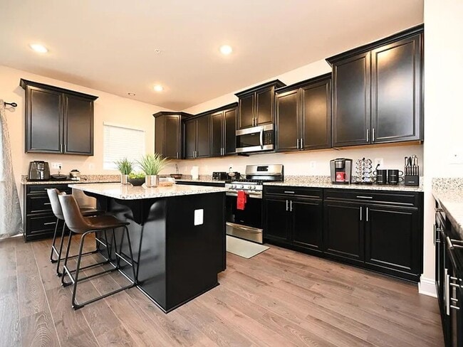 Building Photo - Stunning 3-Story Brick-Front Townhome | Modern Living + Military & First Responder Discount