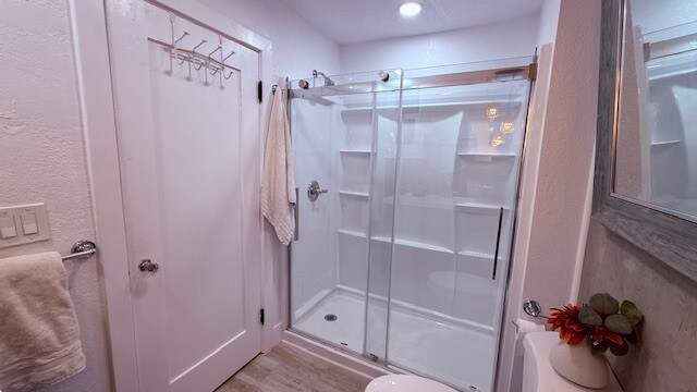 New oversized shower with glass sliders and built-in shelving. - 24606 University Ave