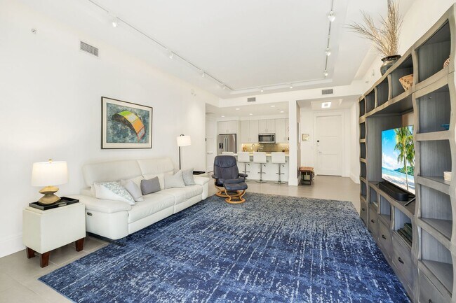Building Photo - Luxury Living Meets Prime Location! Naples Square 2/2 Condo with Expansive Terrace
