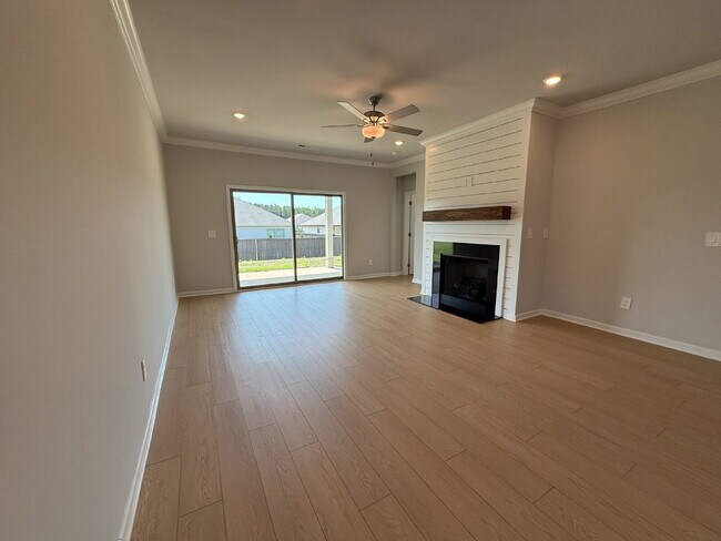 Building Photo - "NEWLY BUILT- Spacious 4-Bedroom Haven with Granite Elegance and Cozy Fireplace in Harvest"