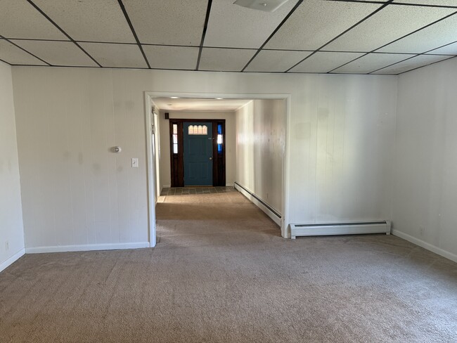 Living room looking toward front door - 22 N Maple Ave