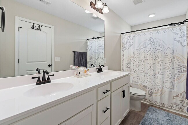 Building Photo - Available Now! Enjoy low-maintenance coastal living in this beautiful 2-bedroom, 2.5-bath townhom...