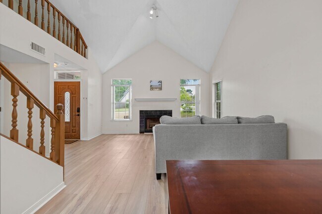 Building Photo - Spacious 3BR Retreat with Soaring Ceilings & Screened Porch