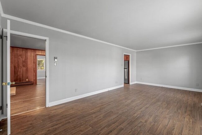 Building Photo - Large Brick Ranch, New Wood Like Flooring Throughout, Just Painted, LR, Den, Sun Room, Carport!