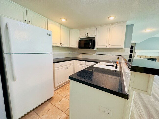 Building Photo - {6411} Enchanted Lake Estates + Updated Kitchen, Fresh Paint Throughout +  Main Floor Primary Bed...