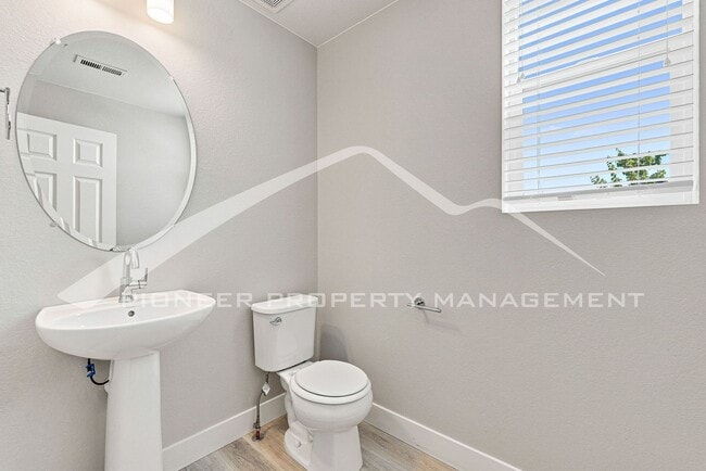 Building Photo - Spacious Townhouse with Central AC and 2-Car Garage