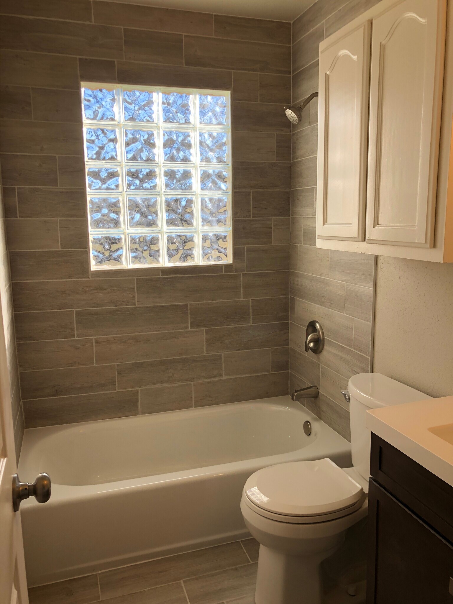 All new, modern glass block window! - 5614 W 3rd St