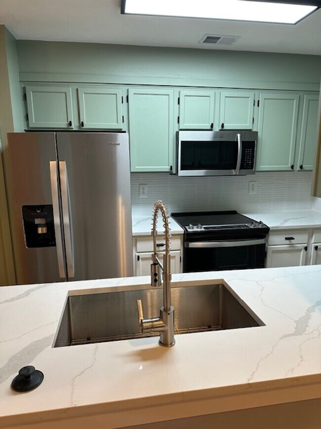 Building Photo - BEAUTIFUL FULLY RENOVATED Townhouse, 2 BR, 2 Bath, Carport & Deck; Pets Ok!