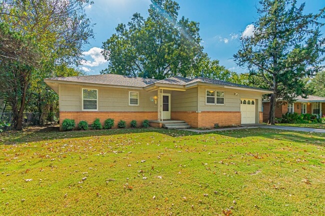 Building Photo - Three Bedroom Home in tree filled neighborhood! Lawn care included!