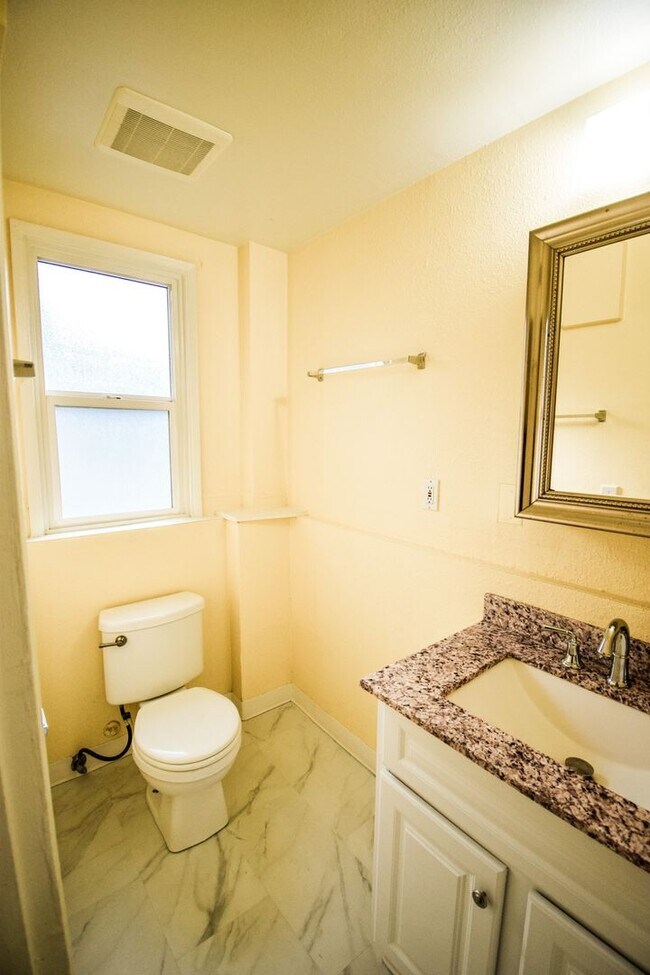 Building Photo - Spacious 4BD/2BA Two-Story Home w/ Fenced Yard & Huge Basement! Pets OK!