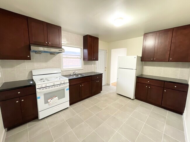 Updated kitchen w/ new appliances - 43-11 172nd Street