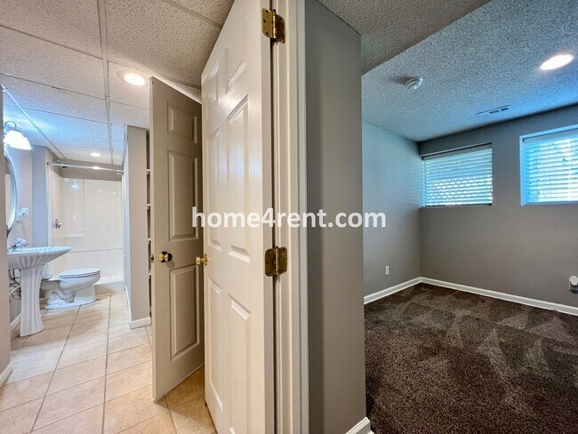 Building Photo - Updated Kitchen, Large Two Tiered Deck, Finished Basement in Blue Valley Schools!