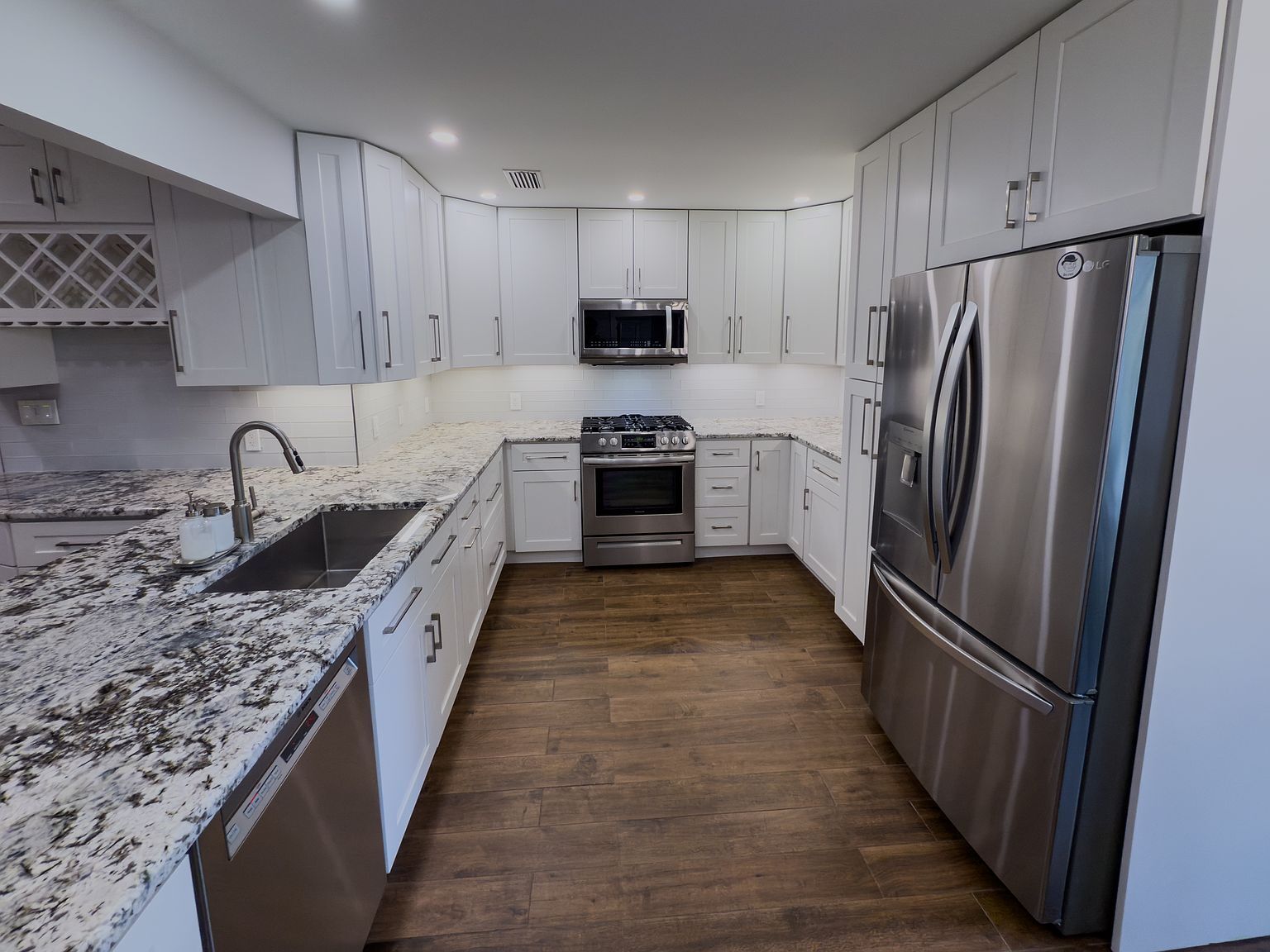 Kitchen countertops, white cabinetry, and stainless appliances - 2006 Candle Ct