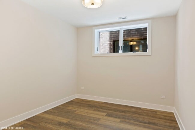 Building Photo - Condo Quality 3,400 SF Duplex Down in Roscoe Village, Pet Friendly Available August 1st