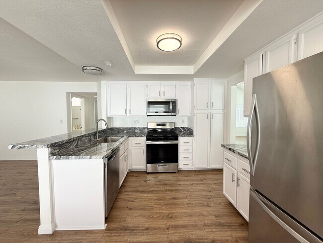 Building Photo - Corner Lot Beauty with Open Living, Guest Suite Down & Expansive Backyard
