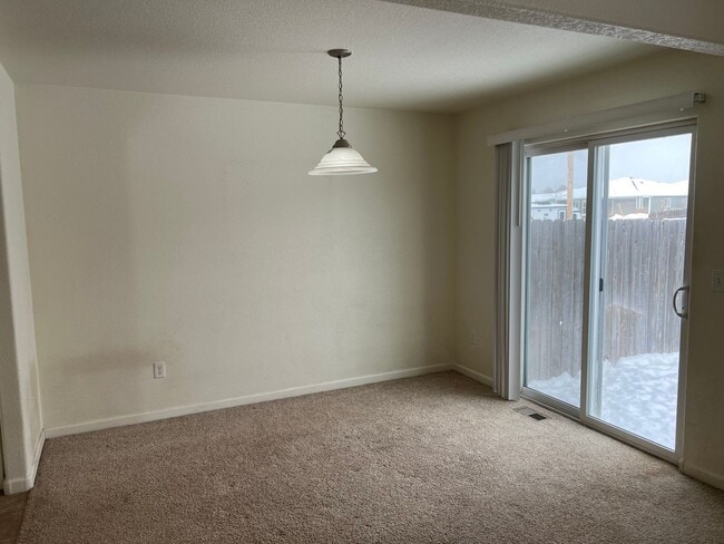 Building Photo - 3 BEDROOM, 2.5 BATHROOM TWINHOME WITH 2 CAR ATTACHED GARAGE