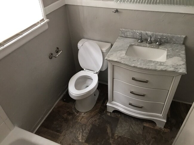 Building Photo - 3 Bedroom/1 bath home on corner lot with a large fenced back yard