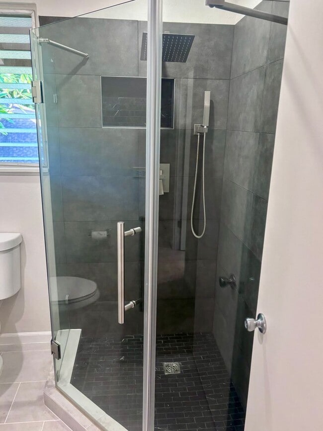 Building Photo - Available Now | 2 Bedroom, 2 Bathroom Townhouse with 1 Assigned Parking Stall at Tropic Gardens 1