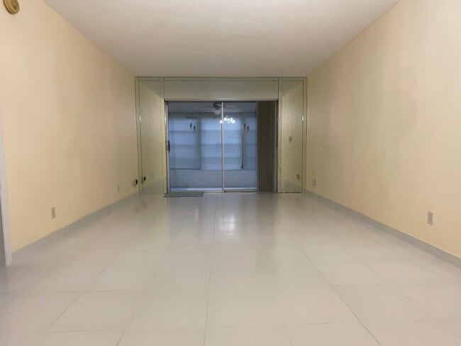 Looking from dining room area toward living living room and sun room - 2900 NW 47th Terrace
