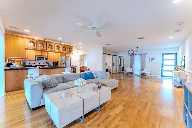 Building Photo - Lake Jessamine Luxury: Solar-Powered Waterfront Retreat on 1.14 Acres with Dock & Boathouse