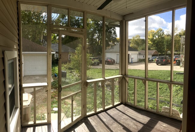 Back screen porch to back yard. - 1233 Jenifer St