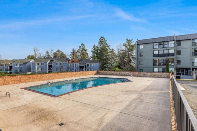 Building Photo - Sweet & Cozy 2/1 condo available in Mt. Park with covered parking, in-unit laundry, outdoor pool ...
