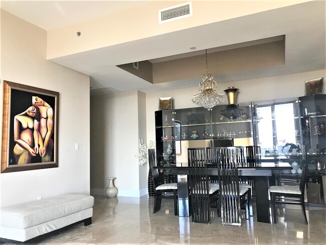 Dining Room with crystal chandeliers - 15901 Collins Ave