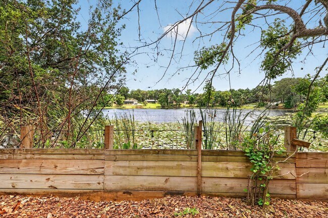Building Photo - Available Now! Waterfront Living at Its Best – Pool, Decks & Gated Privacy