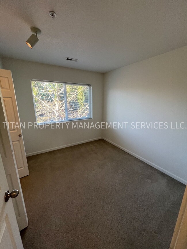 Building Photo - Beautiful Three Story Townhouse with Gas Fireplace, Balcony & 2-Car Garage