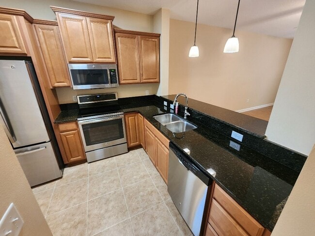 Building Photo - 50% off this beautiful 2/2 Bouchelle Condo with private garage, see details*