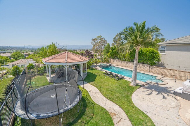 Building Photo - Spectacular 5-Bedroom Home with Pool, RV P...