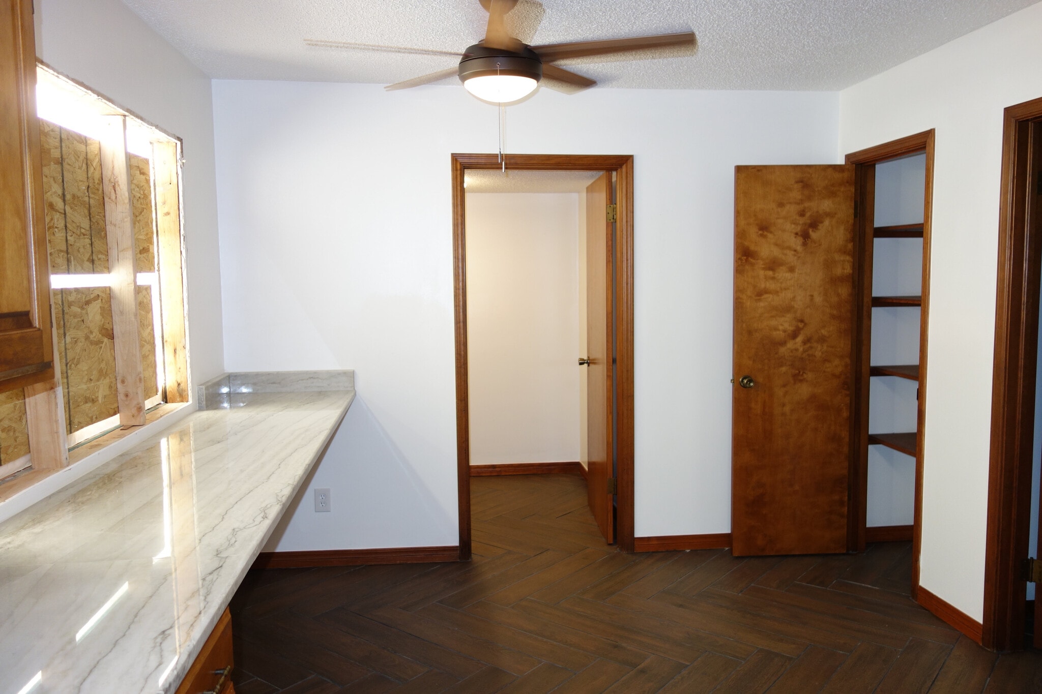 Kitchen, Bar top to the left, Laundry room ahead, and pantry on the right - 7116 S Indianapolis Ave