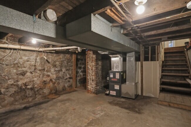 Building Photo - This well-maintained 4-bedroom, 2-bath duplex offers a spacious layout with all the comforts of h...