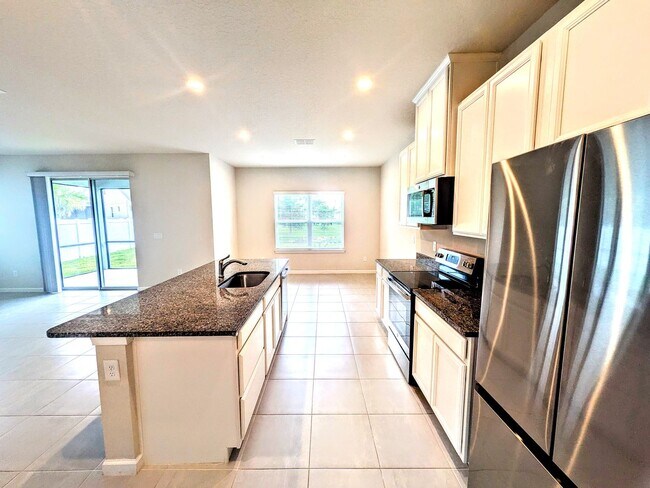 Building Photo - Annual UNfurnished NEW 4/ 2 1/2 home off S...