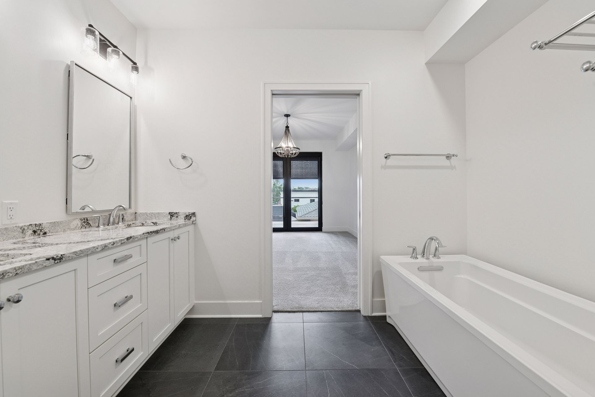 Private primary bath with heated tiled floors, double vanity areas, and great cabinet space - 222 Ferndale Rd S