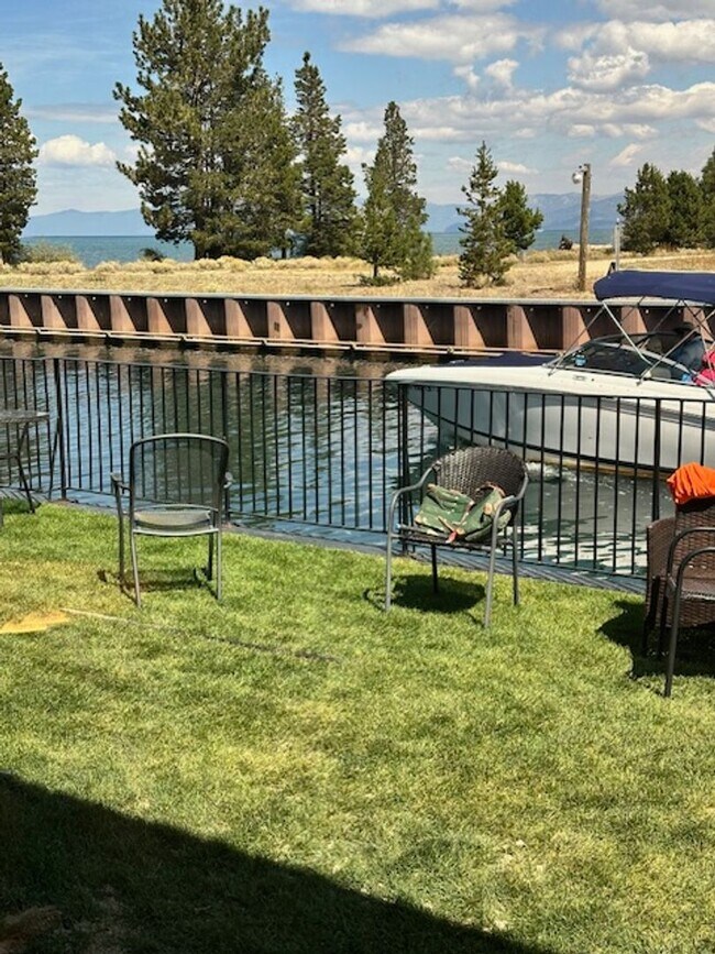 Building Photo - Condo with beautiful channel views and boat slip available for a Winter or Summer seasonal 3-6 mo...