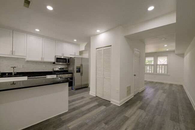 Building Photo - Charming & Renovated Petworth Rowhouse with Parking -  Available Now!