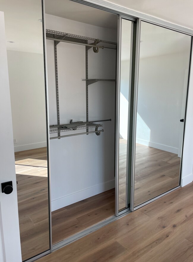 first bedroom 11 ft closet with organizers - 1741 Granville Ave