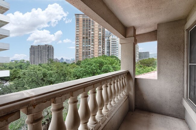 Building Photo - Gorgeous Mediterranean-style condo located...