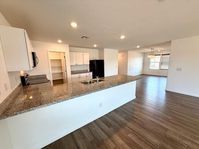 Building Photo - Spacious 4 Bedroom Home with Solar & Modern Upgrades- Available Now!