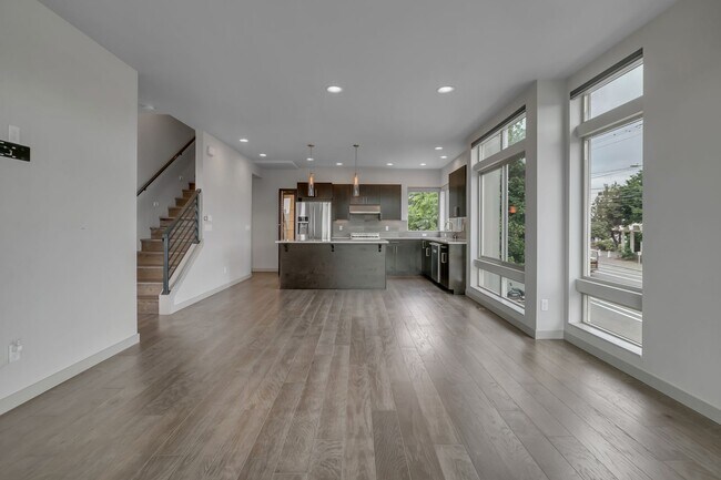 Building Photo - Modern Townhouse with Rooftop Deck & Skyli...