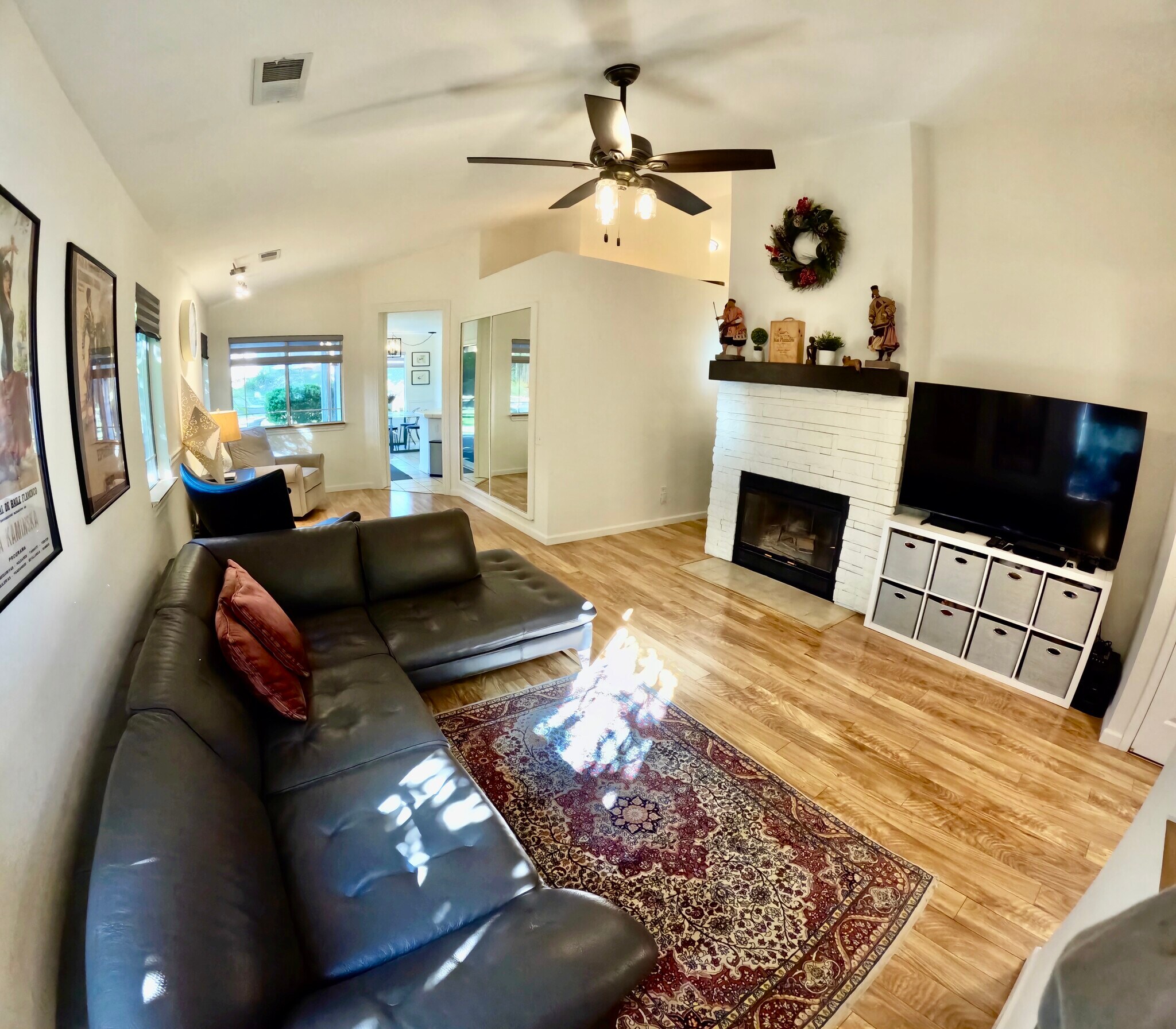 Living room with large framed mirror & working fireplace - 4929 Chelsea Glen Ct