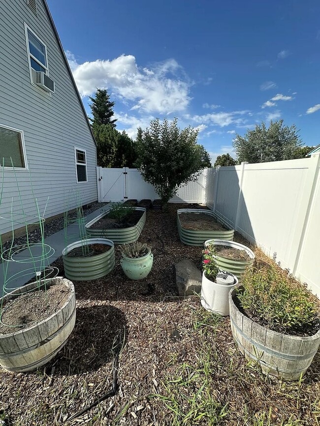 Building Photo - Ideally Located and Updated 4 Bed 2 Bath Fully-Fenced Home w/ Detached Garage/Shop!