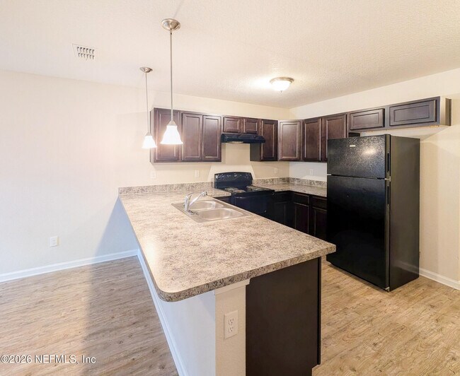 Building Photo - 8441 McGirts Village Ln