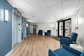 Welcome to Chardon Court Senior Apartments, where modern design meets comfort. Our spacious lobby features stylish seating and convenient elevator access, making life effortless. Explore your new home today-schedule a tour and see for yourself! - Chardon Court Senior Apartments