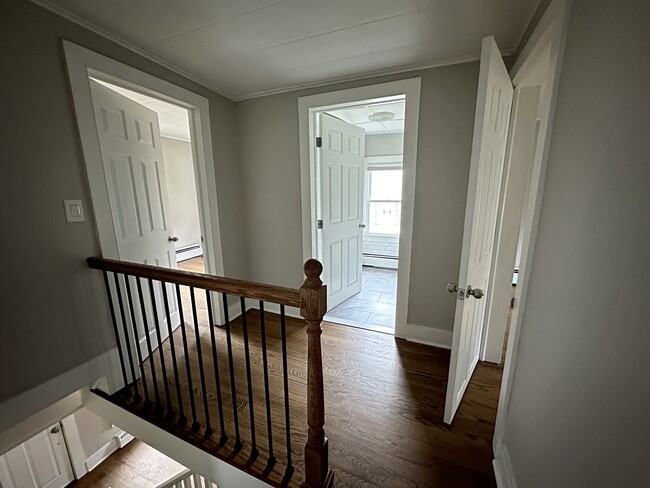 Upstairs hallway (standing in Master onlooking Bedroom 2, Bathroom, Bedroom 3) - 22-24 E Main St