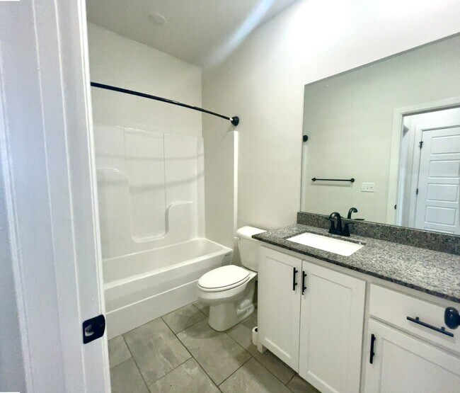 Building Photo - Centerton Home Available NOW! 4 bed, 2 full bath no carpet home. LARGE fenced backyard