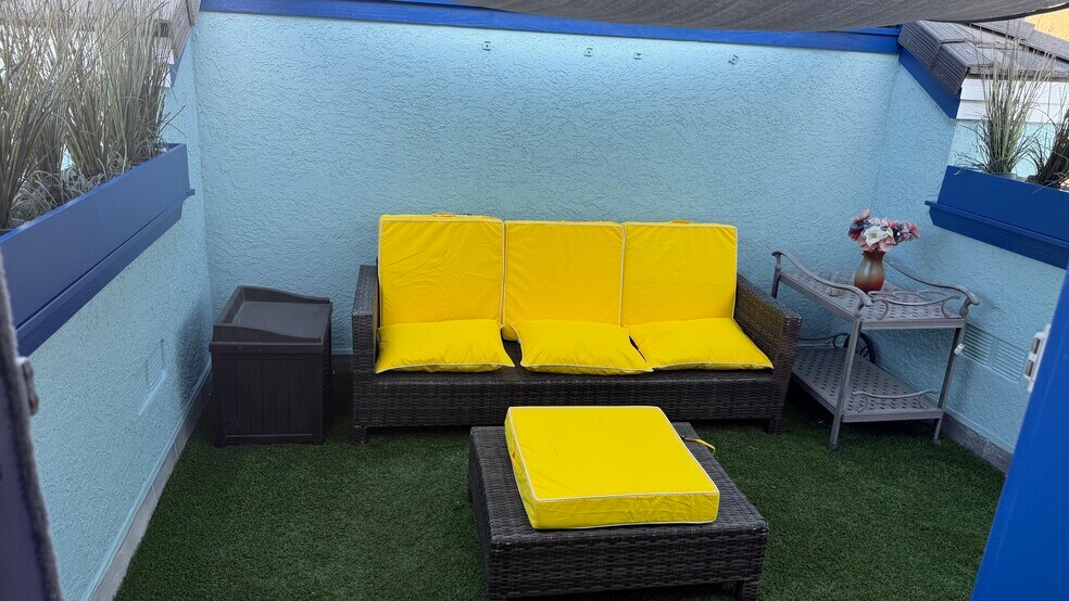 Covered patio upstairs off 2 bedrooms - 700 Lido Park Dr